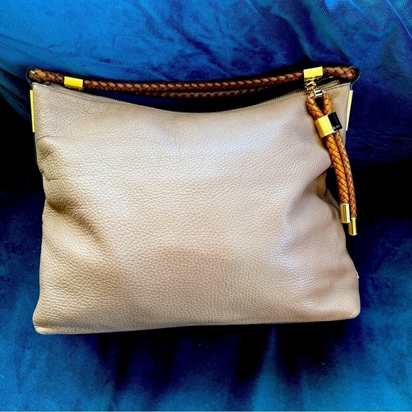 MICHAEL KORS COLLECTION
Skorpios Desert Tan Pebbled Leather Hobo
Bag $79… - Picture 5 of 16